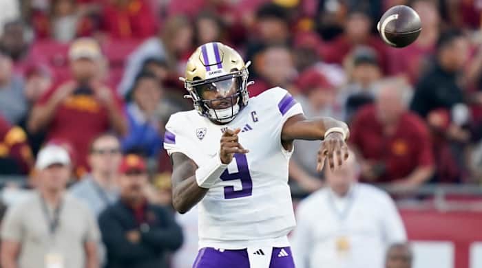 Washington quarterback Michael Penix Jr. throws a pass while playing against USC.